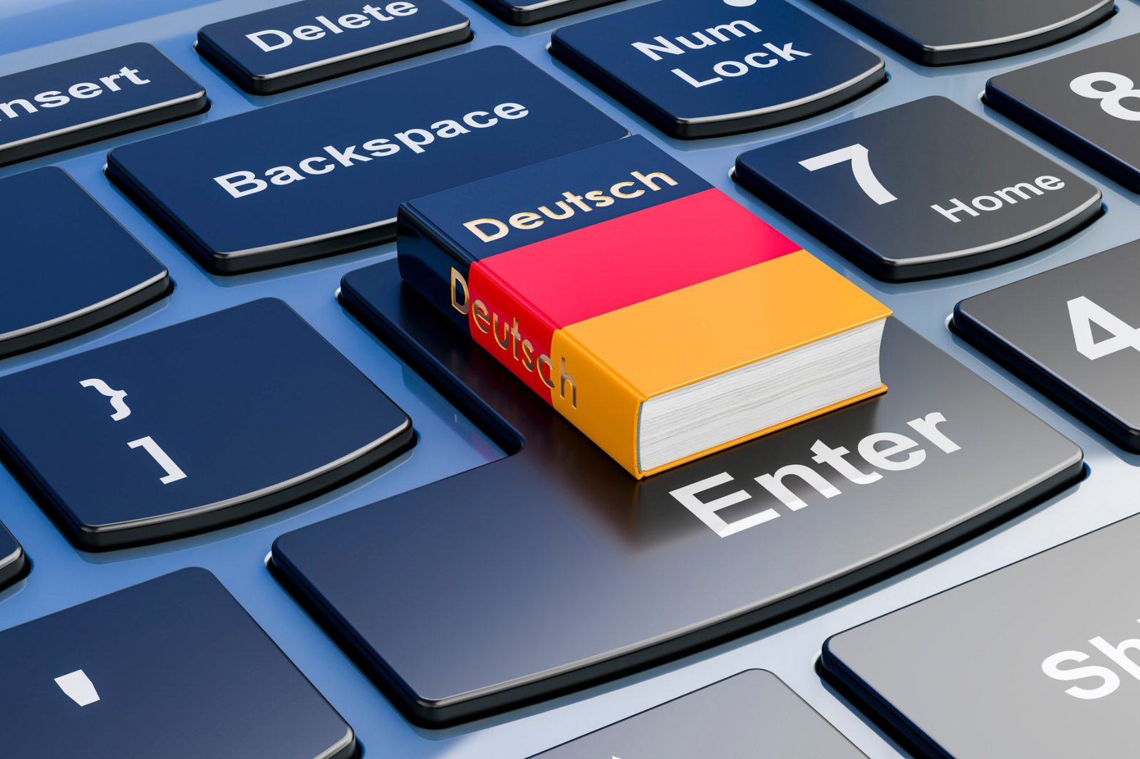 Ein Buch mit der Aufschrift „Deutsch“ in den Farben Schwarz, Rot und Gold liegt auf der Eingabetaste einer Computertastatur